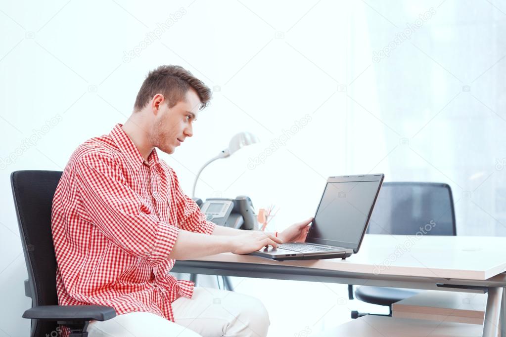 Office worker working on computer in office