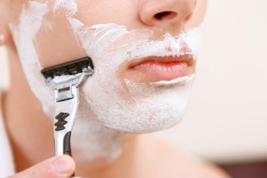 Close up of shaving man clipart