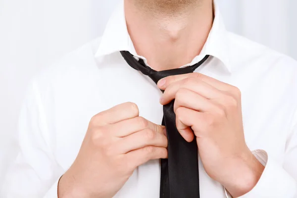 Close up of man fixing his tie. — Stock Photo, Image