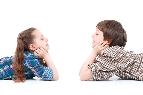 Brother and sister having fun on the floor — Stock Photo, Image