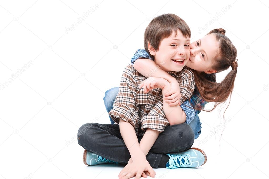 Brother and sister having fun on the floor