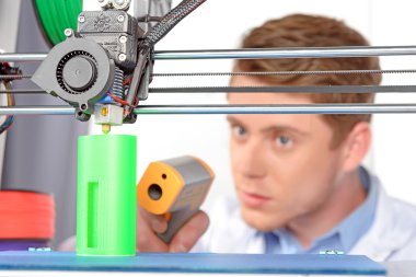 Scientist working with three-dimensional  printer clipart