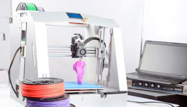 Three-dimensional printer during work clipart