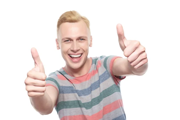 Smiling young man with thumbs-up — Stock Photo, Image