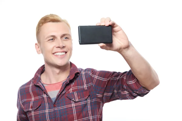 Jonge lachende man nemen foto — Stockfoto