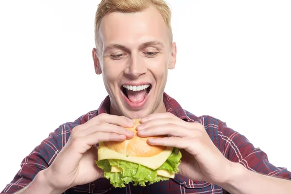 Man taking bite of sandwich — Stock Photo, Image