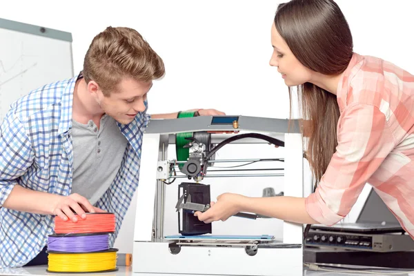 Two students with three-dimensional printer — Stock Photo, Image