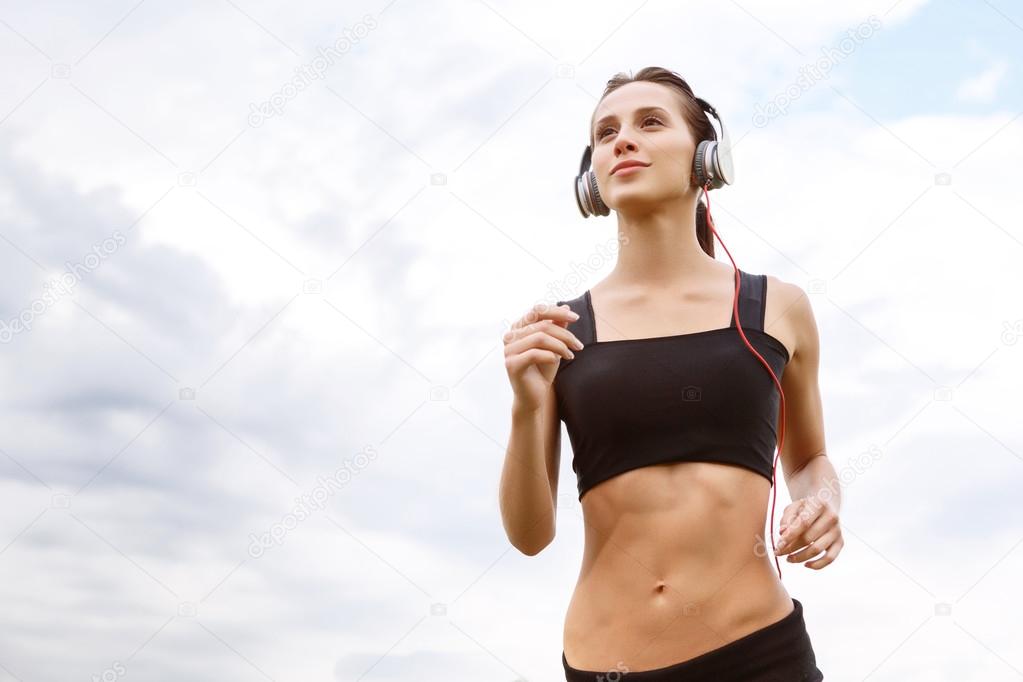 Portrait of running woman outside