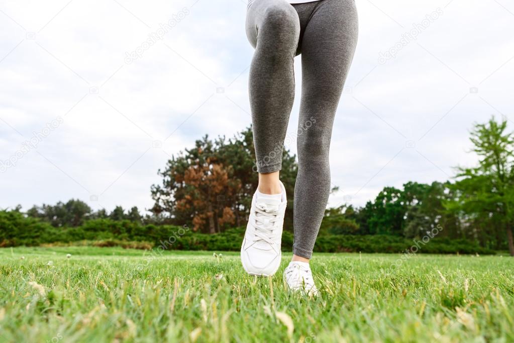Close up of woman legs in park