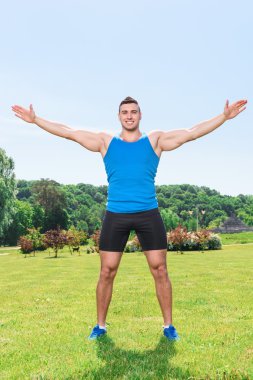 Muscled sportsman during training clipart