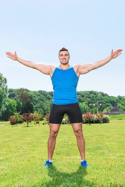 Muscled sportsman during training — Stock Photo, Image