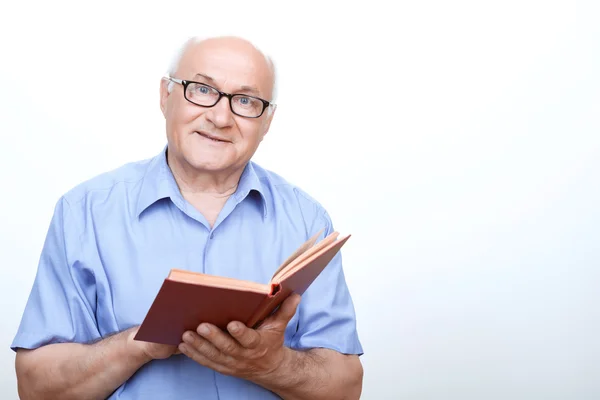 Pleasant grandfather reading favorite book — Stock Photo, Image