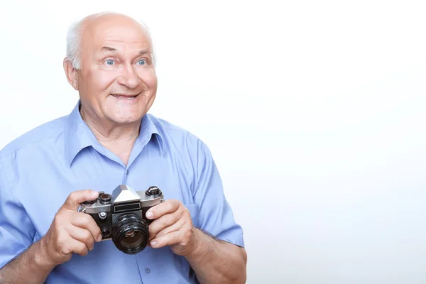 Vivacious grandfather holding camera — Stock Photo, Image
