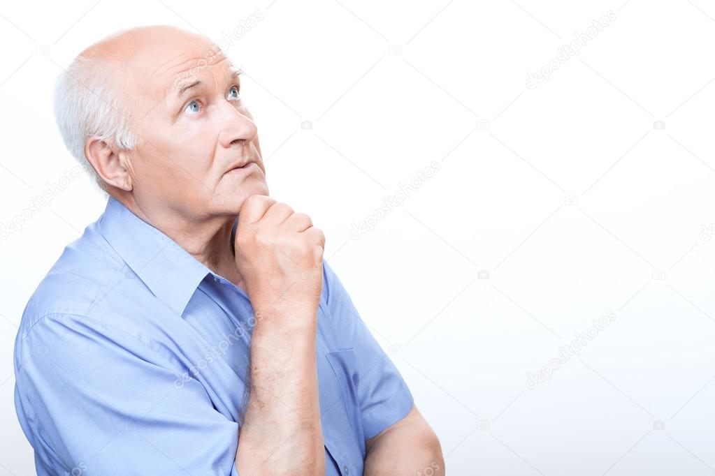 Reflective grandfather involved in thinking