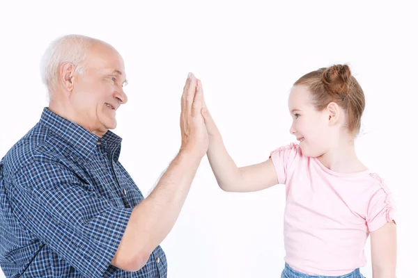 Grandfather having fun with his granddaughter — Stock Photo, Image