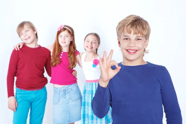 Nice boy smiling on the forefront. — Stock Photo, Image