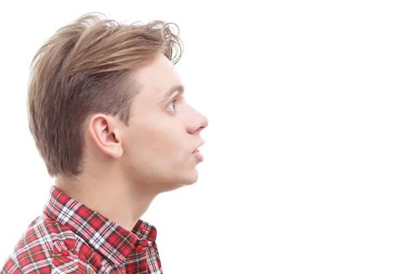 Surprised young guy standing half-face — Stock Photo, Image