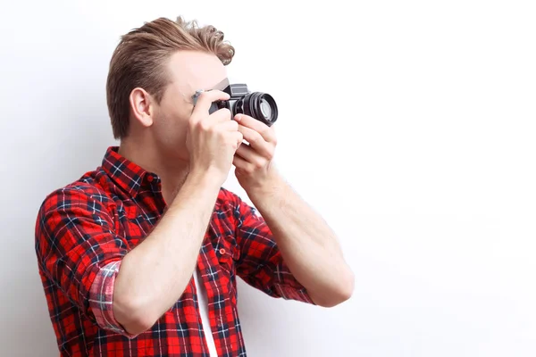 Vivacious guy holding camera — Stock Photo, Image