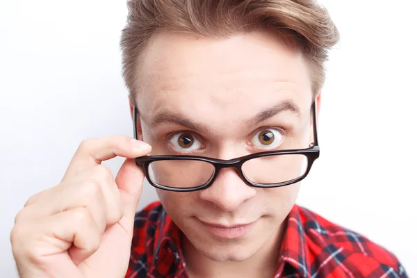 Surprised guy holding glasses — Stock Photo, Image