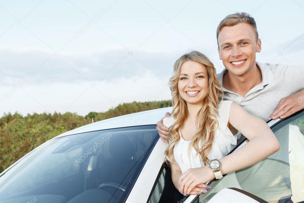 Lovely couple near the car