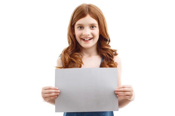 Girl holding  sheet of paper Royalty Free Stock Photos