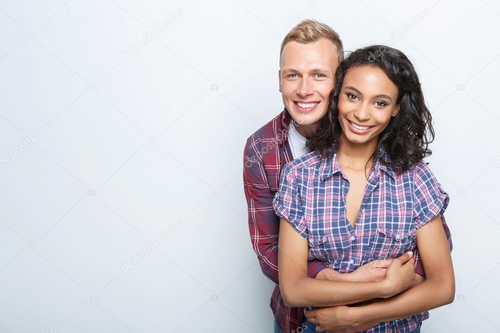 Lovely couple isolated on grey