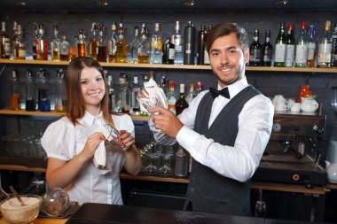 Bartender and a waitress during work