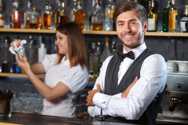 Bartender and a waitress during work