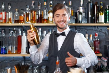 Handsome bartender during work