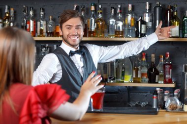Bartender talking to visitor