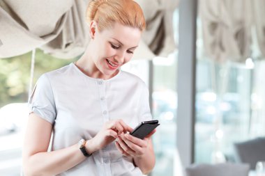 Businesswoman in a restaurant.Waiting for a partner.