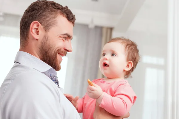 Nice father holding baby — Stok fotoğraf