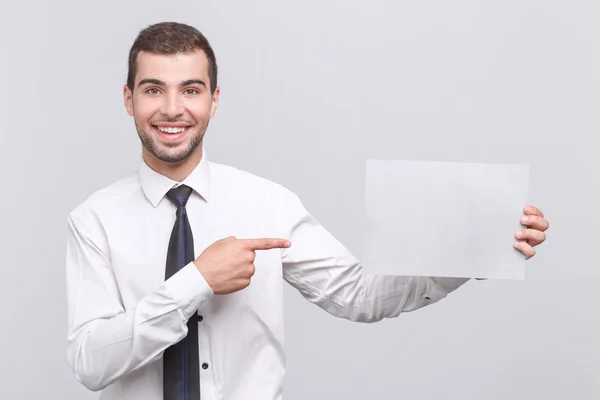 Handsome young man isolated on grey — Stock Photo, Image