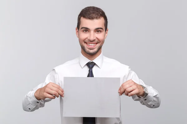 Handsome young man isolated on grey — Stock Photo, Image