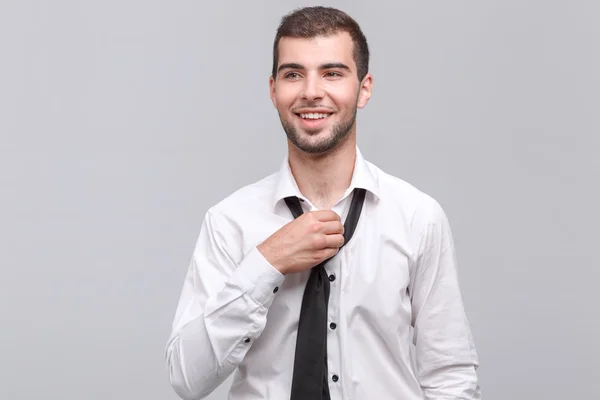 Handsome young man isolated on grey — Stock Photo, Image