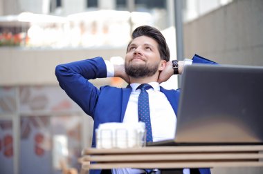 Pleasant young man sitting in cafe