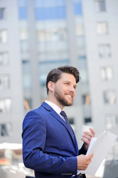 Pleasant businessman drinking coffee — Stock Photo, Image