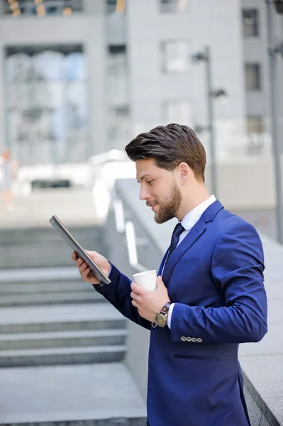 Pleasant businessman drinking coffee — Stock Photo, Image