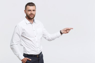 Businessman pointing aside