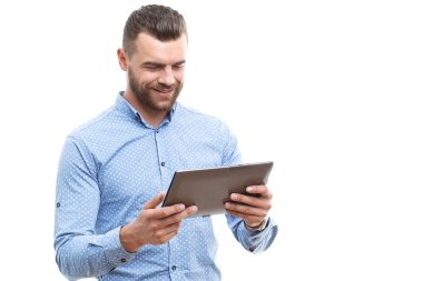 Man with beard holding tablet 