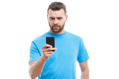 Man with beard holding mobile phone