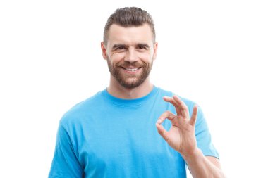 Handsome man with beard showing ok