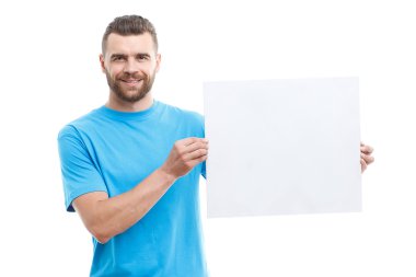 Man with beard holding paper sheet