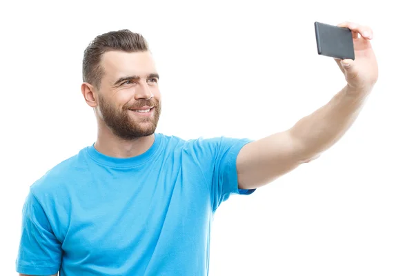Man with beard doing selfie — Stockfoto