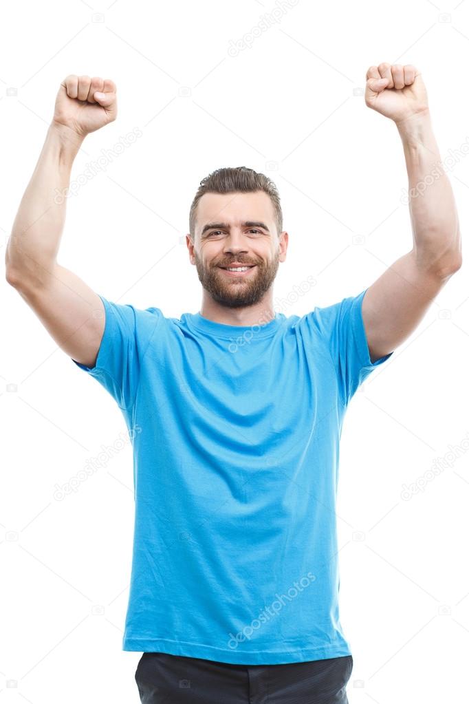 Cheering man with raised arms 