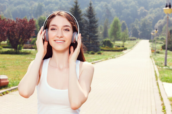 Smiling girl listening to music 