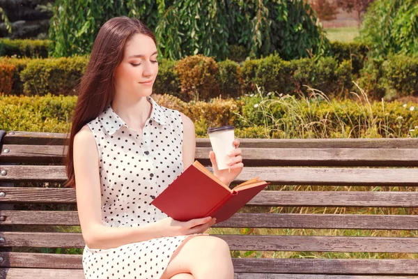 Pleasant girl reading book — Stock Photo, Image