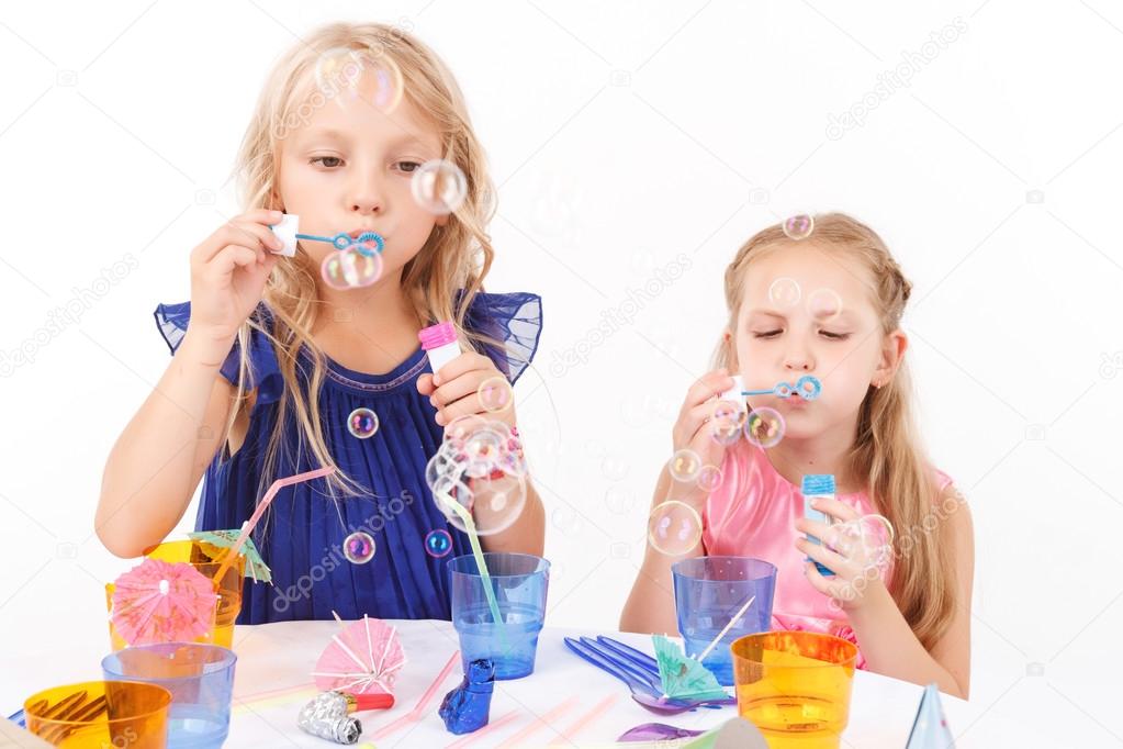 Children blowing soap bubbles 