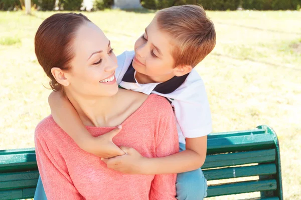 Little boy embracing his mother — Stock Photo, Image