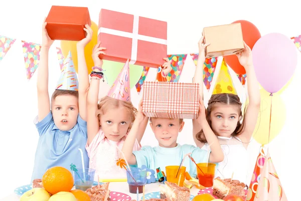 Little children posing with birthday presents — Stock Photo, Image